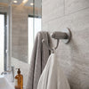 Soho Collection Robe Hook shown in the Matte Gray finish in a bathroom setting
