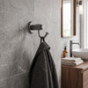 Tribecca Collection Robe Hook shown in the Matte Gray finish in a bathroom setting